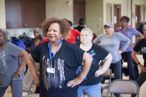 Seniors attend a group exercise class